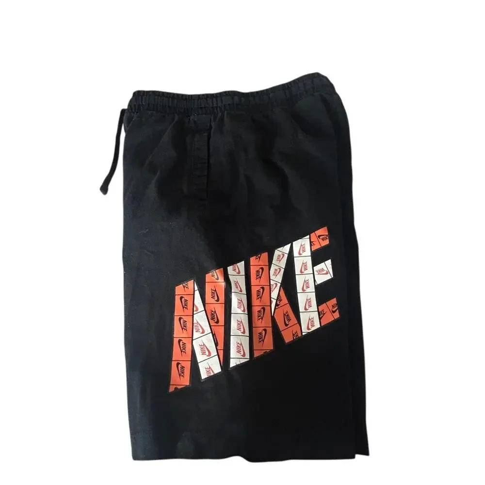Nike boys large black cotton knit athletic shorts orange and white Nike logo